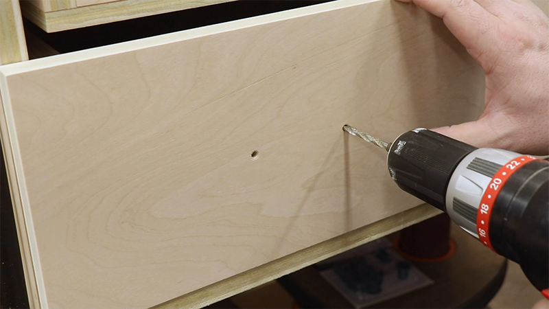 Drilling out the drawers for the pulls